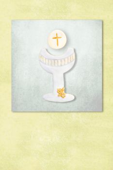 Cute chalice celebrating first communion invitation card, Background with copy space.