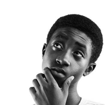 Portrait of a boy looking up at copy space, white background