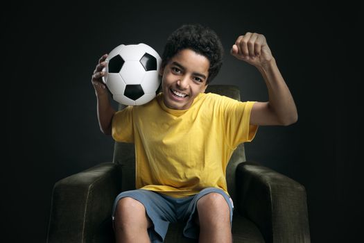 Happy young boy celebrating the victory