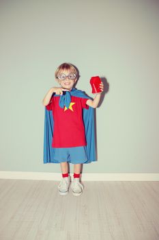 A young boy dreams of becoming a superhero.