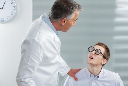Optometrist talking with a young patient with a big problem