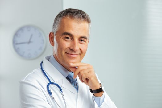 Portrait of a handsome male doctor smiling at camera