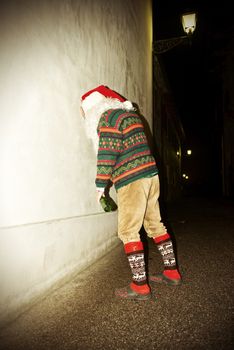 Staggering Drunk Santa Holding on a Wall