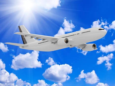 White passenger airliner flies under the bright sun in the blue sky above the clouds