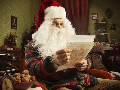 Portrait of Santa Claus reading a letter