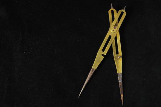 Vintage Angle Measuring Tool on a Black Background