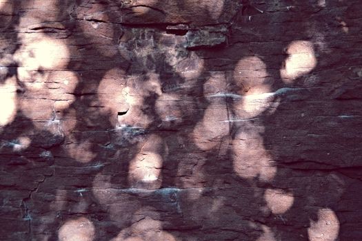 sandstone rocks with reflections of sunlight circular form