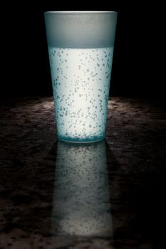 Drink lit up against a dark background