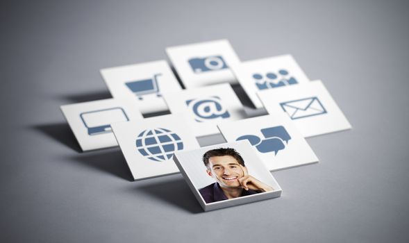 Portrait of young smiling man with tecnology icons