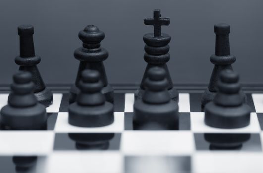 Close-up photo of the chessmen on a chessboard