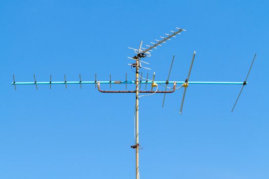 television antenna on clear blue sky
