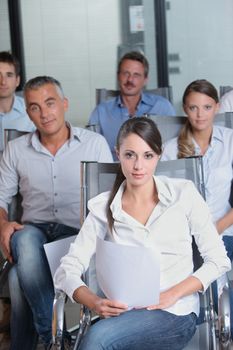 Portrait of a confident business team sitting together in the office 