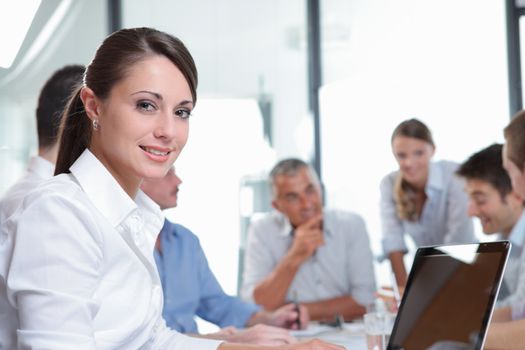 Portrait of a pretty businesswoman smiling during a meeting