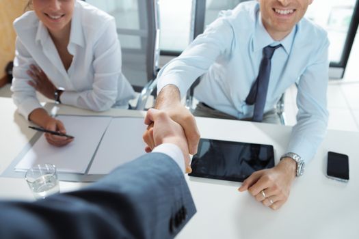 Businessman being welcomed into the company by his new colleagues 