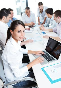 Portrait of a pretty businesswoman smiling during a meeting