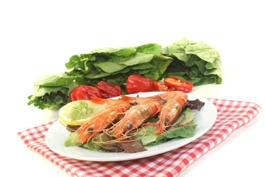 orange prawns on salad with lemon and dill