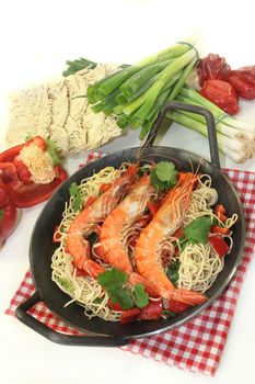 Black tiger prawns on Mie noodles with vegetables