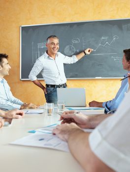 A group of businesspeople sitting in a seminar 