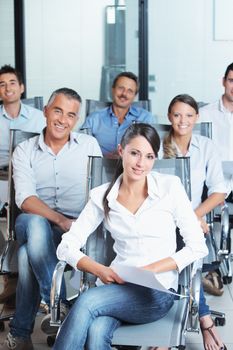 Portrait of a confident business team sitting together in the office 