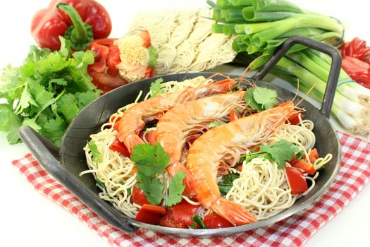 Black tiger prawns on Mie noodles with vegetables