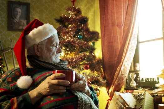 Pictures of Santa Claus relaxing at home enjoying coffee