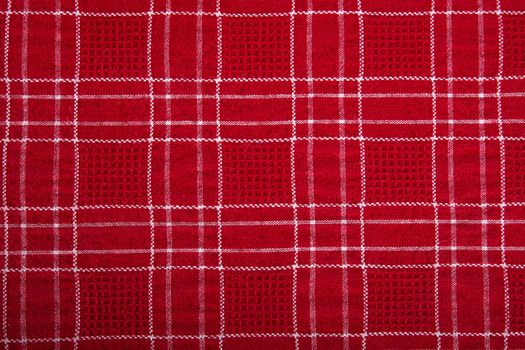 Material into red grid, a textile background.