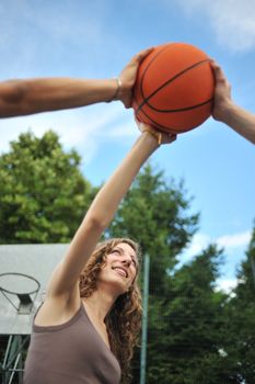 Friendship & sport. Three teenagers holding a basket ball