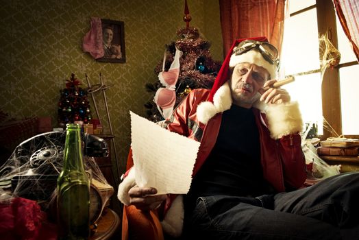 Bad Santa reading a letter at home