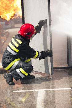 Firefighter fighting fire during training