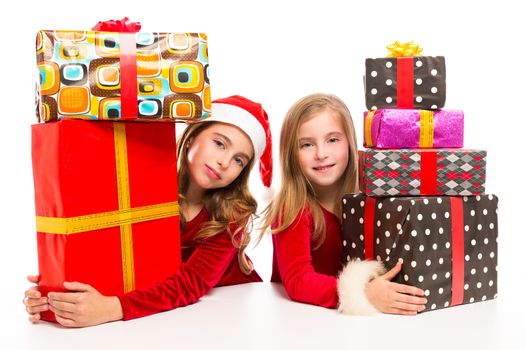 Christmas Santa kid girls with many gifts stacked isolated on white