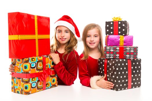 Christmas Santa kid girls with many gifts stacked isolated on white