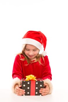 Christmas Santa blond kid girl happy excited with ribbon gift isolated on white background
