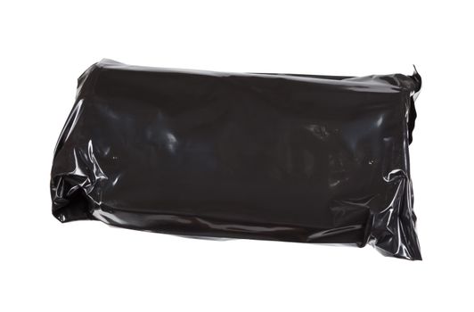 black cellophane packet with unknown contents isolated on white background