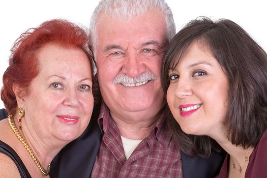 Close portrait of senior couple and their middle age daughter all three of them showing their happiness perhaps its fathers day