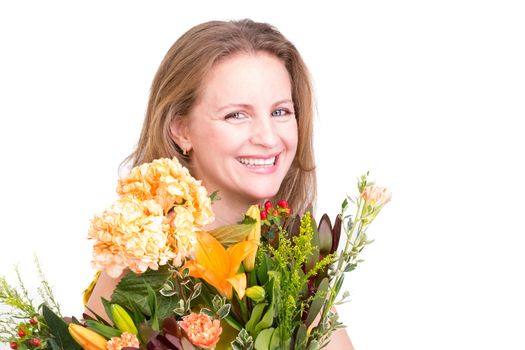 Happy woman smiling behind the flower bouquet expressing her feelings genuinely