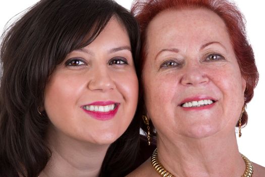 Senior mother and her middle age daughter cheek to cheek portrait, perhaps its mother's day