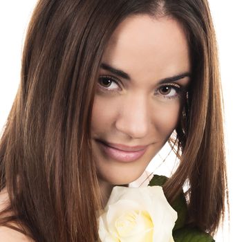 Portrait of beautiful woman with white rose in studio