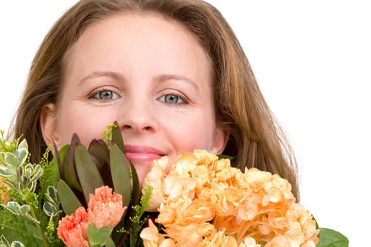 Happy woman smiling behind the flower bouquet expressing her feelings genuinely, isolated on white