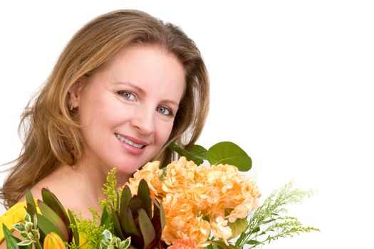 Happy woman smiling behind the flower bouquet expressing her positive feelings genuinely