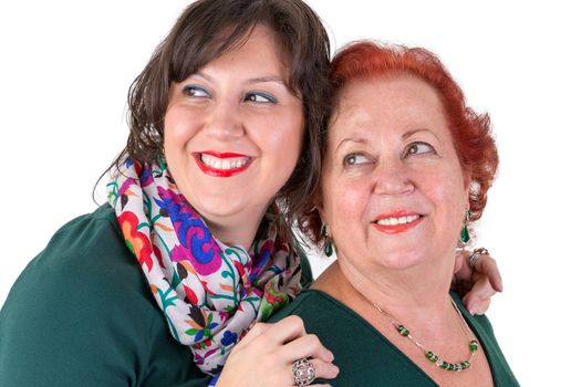 Senior mother and her middle age daughter next to each other looking out portrait, perhaps its mother's day