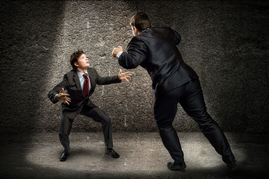 two businessmen fighting as sumoists, the concept of competition in business