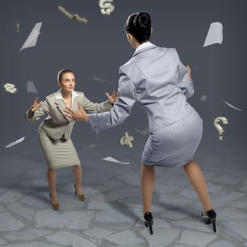 two businesswomen fighting as sumoists, the concept of competition in business