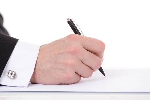 Closeup of the hands of a businessman taking notes holding a pen over a blank sheet of paper as he prepares to begin writing