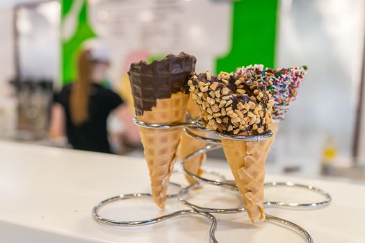 Ice cream cones in store on metal rack