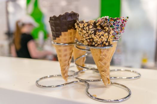 Ice cream cones in store on metal rack