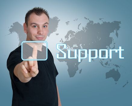 Young man press digital support button on interface in front of him