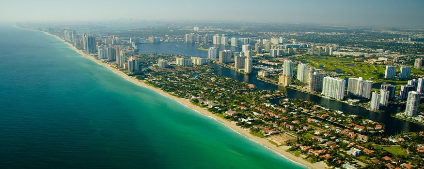 An aerial view of Miami���s seashore with deep green and blue water in Florida, USA.