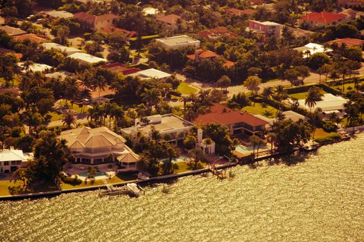 An aerial view of prime real estate in Miami, Florida on a golden sunny afternoon.