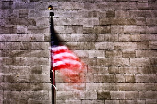 American flag with wall of Washington Monument in background, Washington D.C, U.S.A.