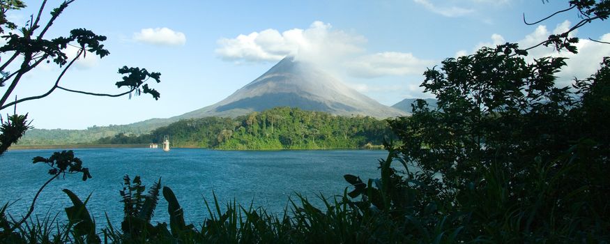 Panoramic scenic view of Arenal volcano on island of Costa Rica.